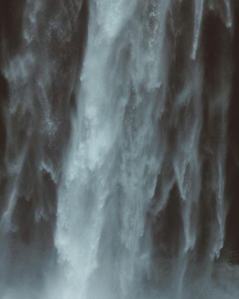A powerful and misty waterfall in motion captured in high detail.